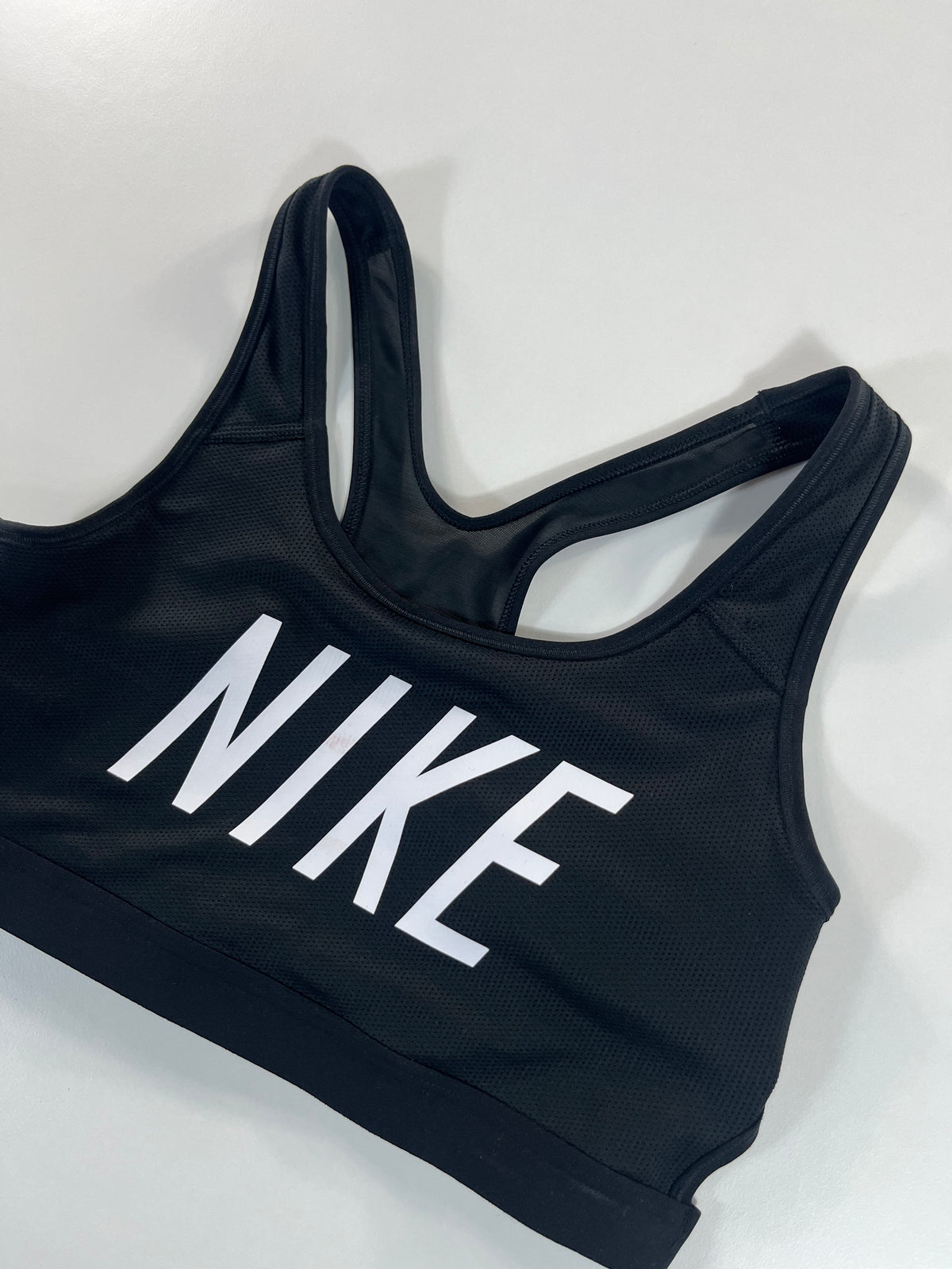 Nike sport melltartó